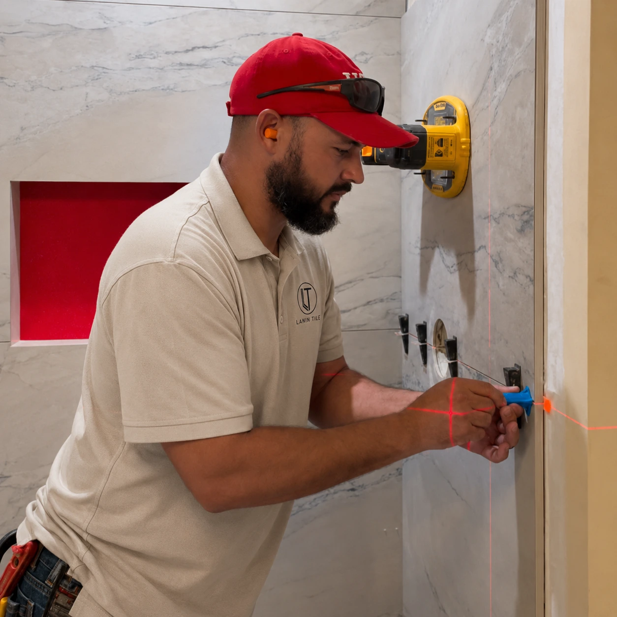 Lanin Tile LLC installer placing tile with suction tool in Sarasota FL